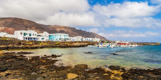 Houses by the sea and the rocks in Órzola, Lanzarote, Canary Islands