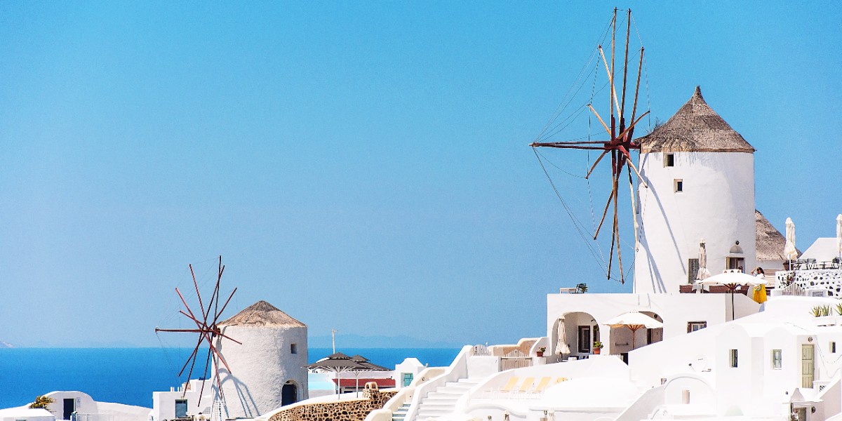 Santorini village, volcanic rock, white houses, sea, view from ferry