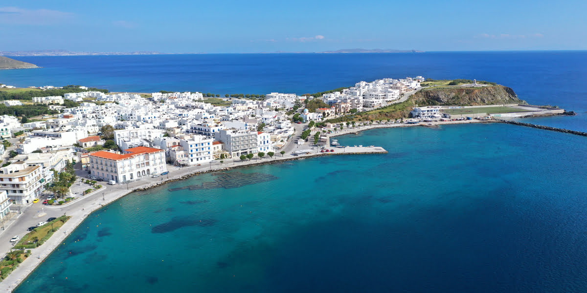 The island of Tinos, houses, hills, blue sea, ferry departure, Aegean islands