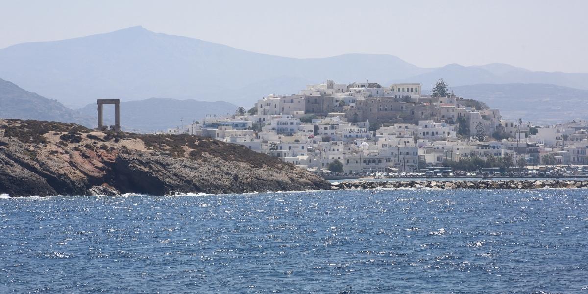 Portara archaeological sites, the town and castle of Naxos as seen from the ferry arriving at the island