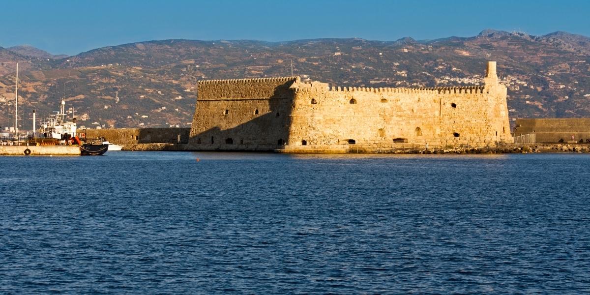 Fortress at the old port of Heraklion, mountains, city, waves, sea
