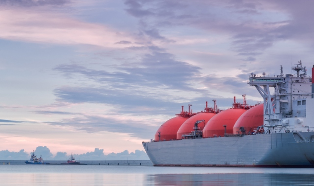 cargo ferry, red tanks with fuel, purple sky, environmental sustainability