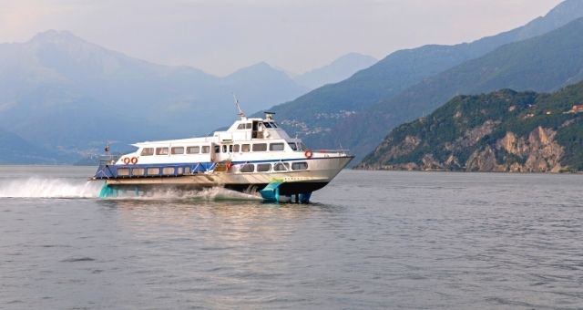 A hydrofoil sailing near a coast in Italy