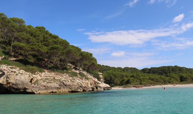 Calm waters and few people in Cala Escorxada in Menorca