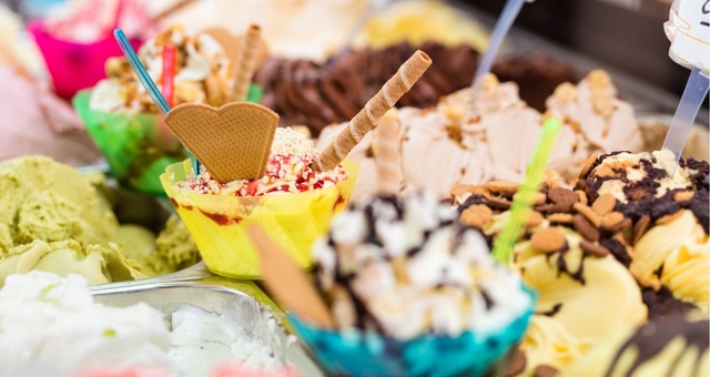 Various flavors of ice cream with waffle cookies