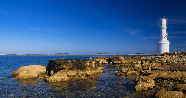 The white lighthouse of La Savina in Formentera, Balearic Islands, Spain