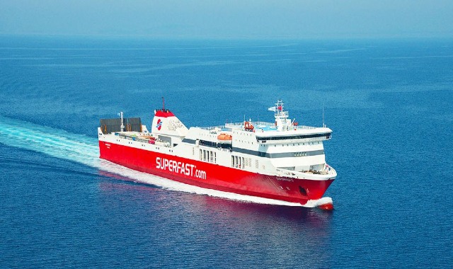 A Superfast ferry sailing across the blue sea between western Greece and Italy