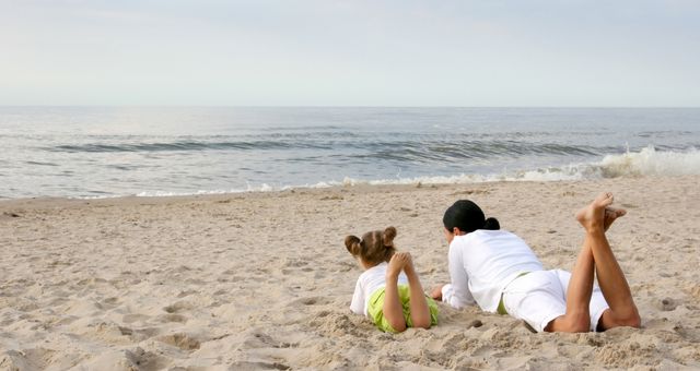 Two family members on an Italian sandy beach