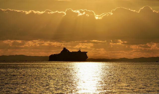 Sunset view of ferry boat in Ionian Sea, Greece