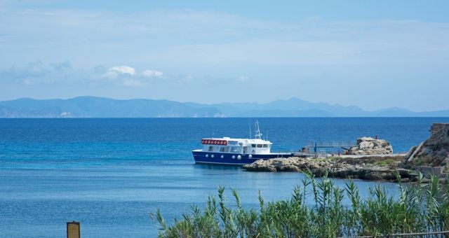 A small ferry at the port of Pianosa island, Italy