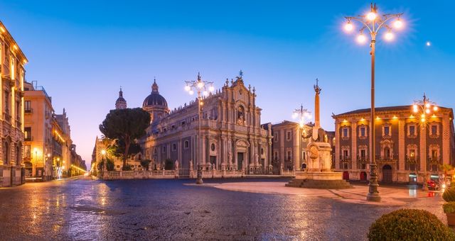 The Piazza del Duomo in Catania, Italy, illuminated in the evening