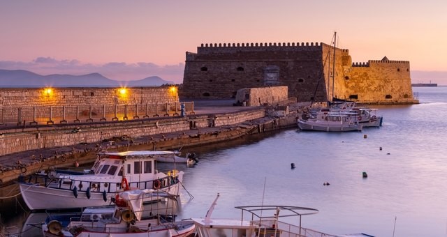 The seaside castle of Heraklion Port in Crete during sunset