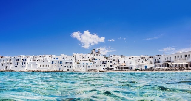 White buildings by the sea in Naoussa town, Paros, Greece