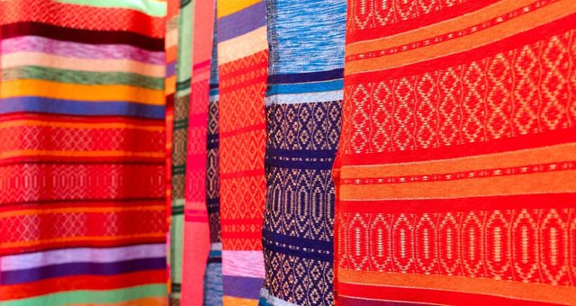 Colorful, hand-woven Berber rugs hanging on the wall, Tangier