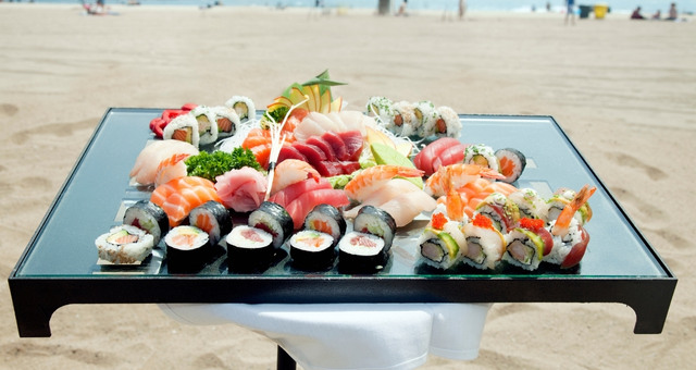 Sushi plate served on table at the beach