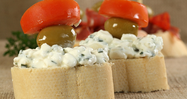 Tapas with cottage cheese, olives and tomatoes