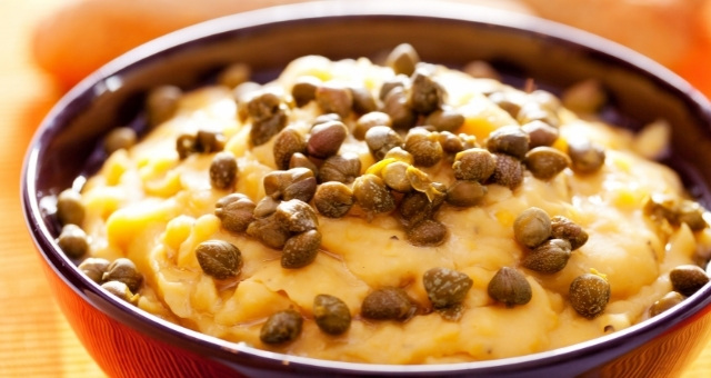 Authentic Greek fava served in a bowl with capers 