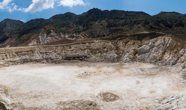 A huge crater surrounded by verdant hills in Nisyros