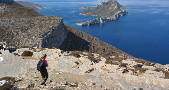 Person going down a rocky hill in Amorgos, Greece