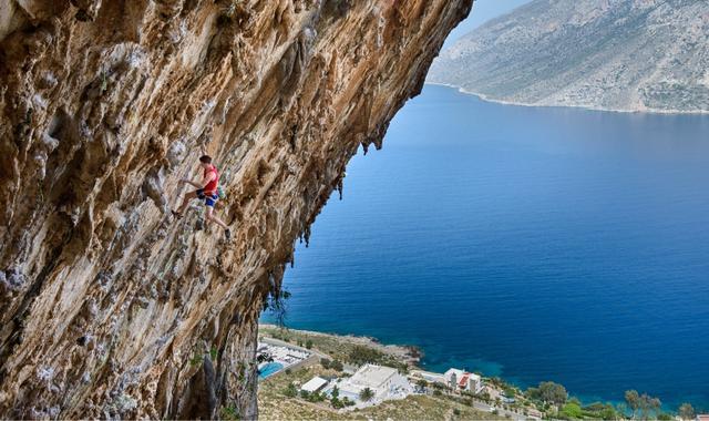 Climber on one of Kalymno's rocky mountains, Dodecanese