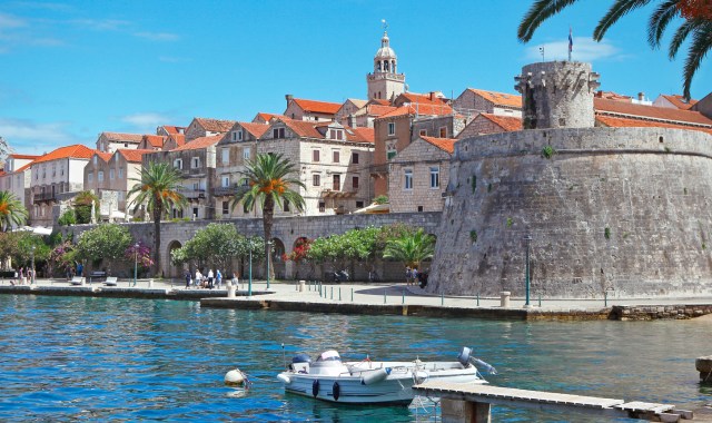 View of the medieval walled town of Korčula and its seafront promenade