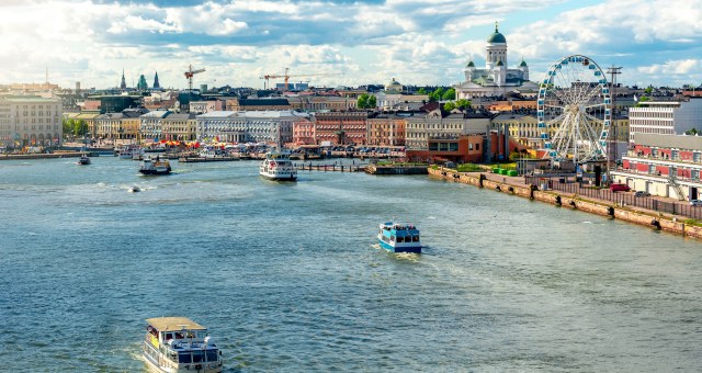 The seafront and city of Helsinki in Finland, with ferry boats sailing