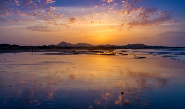 Sunset view of Famara beach in Lanzarote, Canary Islands, Spain