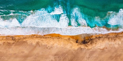 Aerial view of waves crashing on Cofete beach in Fuerteventura, Canary islands, Spain