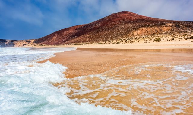 View of Las Conchas beach and Montana Bermeja in La Graciosa, Canary Islands, Spain