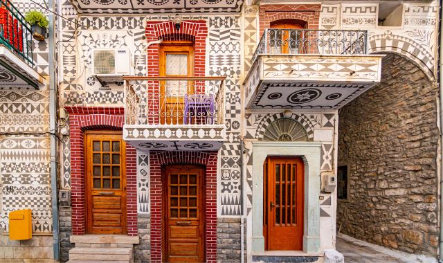 View of houses with black-and-white geometric designs in Pyrgi, Chios, Greece