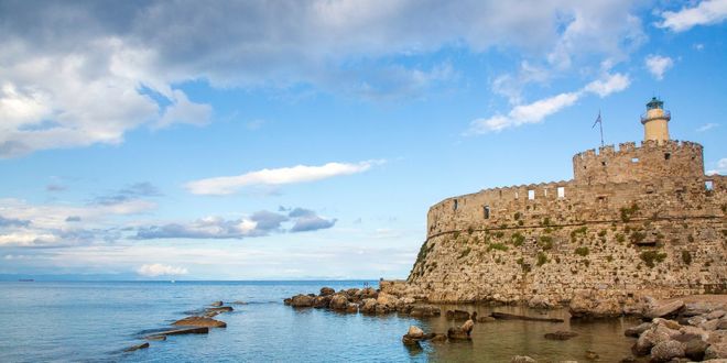 View of Saint Nicholas Fort at Mandraki harbor in Rhodes, Dodecanese, Greece