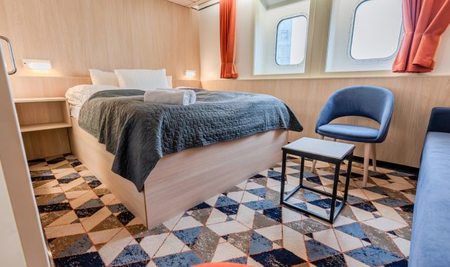 View of double bed in deluxe cabin on DFDS-operated ferry
