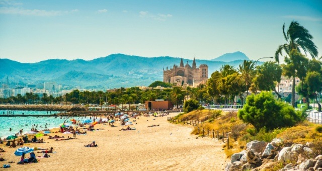 The beach and Cathedral of Palma de Mallorca, Balearic Islands, Spain