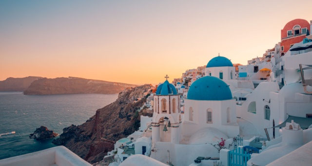 Sunset as seen from Oia town in Santorini island, Cyclades, Greece