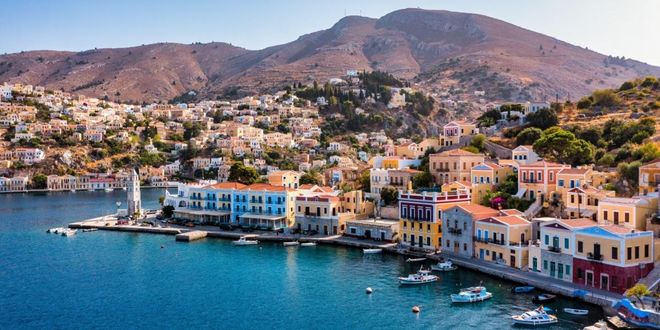 Colorful houses and port in Symi island, Dodecanese, Greece