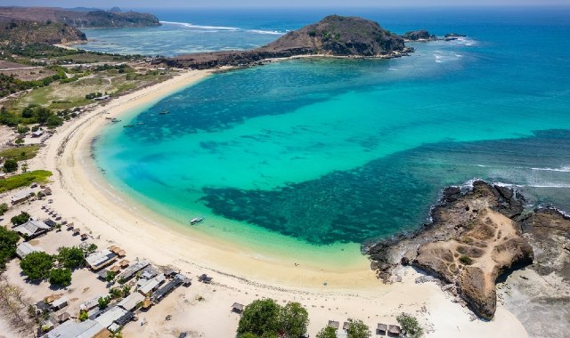 Aerial view of Tanjung Aan Beach, with its horseshoe shape, white sand and turquoise sea