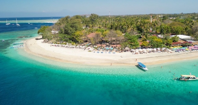 Beach with transparent waters and white sand in Gili Air island, Indonesia