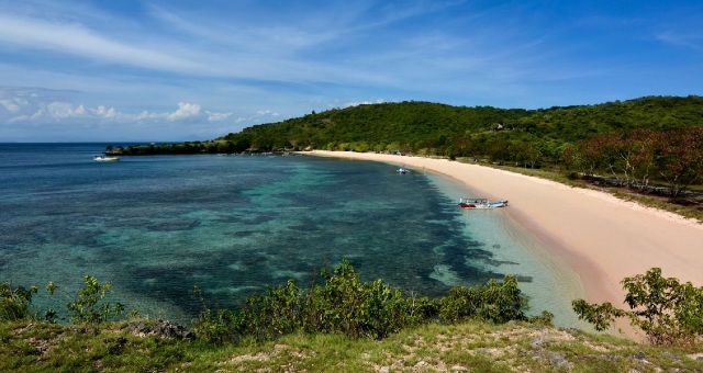 Boat at the coast of the Pink Beach in east Lombok, Indonesia