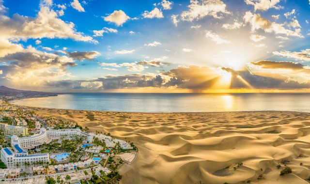 Sunset view of Maspalomas town and dunes in Gran Canaria, Spain