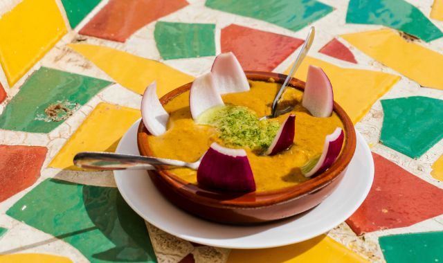 View of a bowl of gofio escaldado on a colorful table