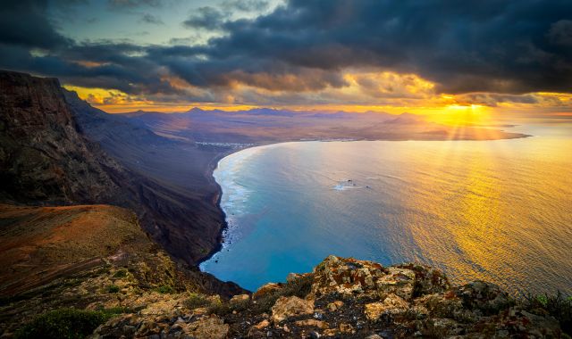 Sunset view at Famara Beach in Lanzarote, Canary Islands, Spain