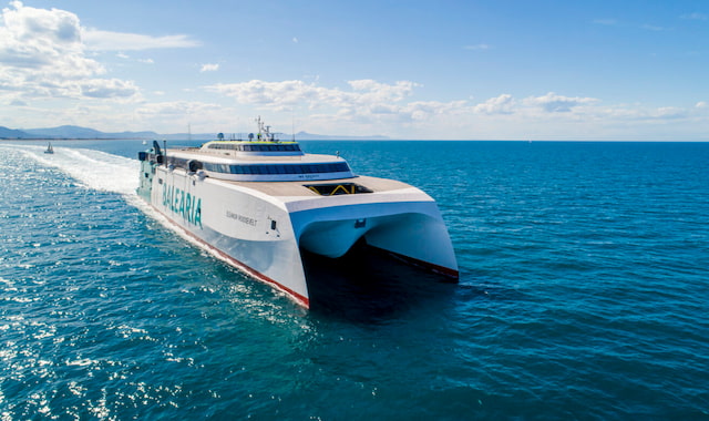 Aerial front view of the massive white Baleària catamaran ferry Eleanor Roosevelt