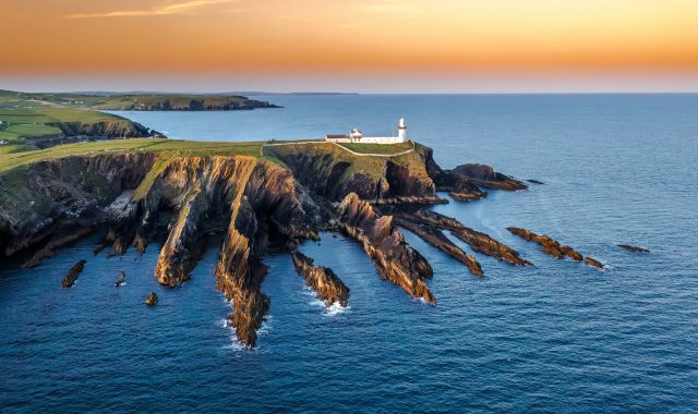 Sunset view of Galley Head Lighthouse in County Cork, Ireland