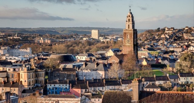 Cityscape of Dublin with the Shandon Tower emerging from other buildings
