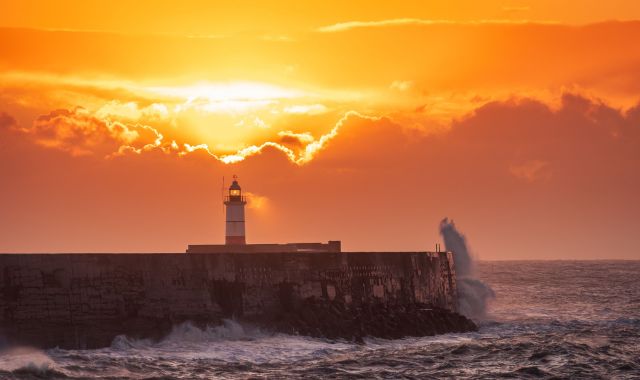 Sunset view of Newhaven Lighthouse in England, UK