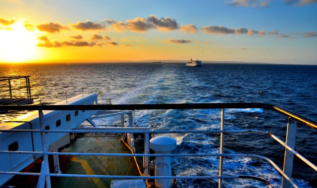 Sunset view of the English Channel from the back stern of a ferry