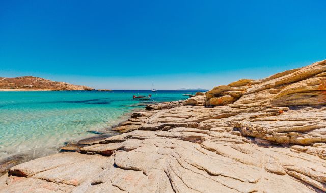 Panoramic view of rocky coastline and beach in Ios, Cyclades, Greece
