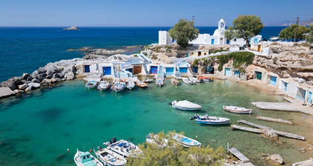 Colorful traditional boat houses and small port in Mandrakia, Milos, Greece