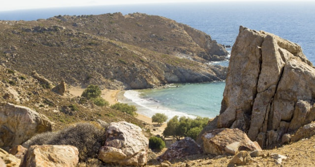 Golden sands and turquoise waters of Psili Ammos beach in Patmos, Greece