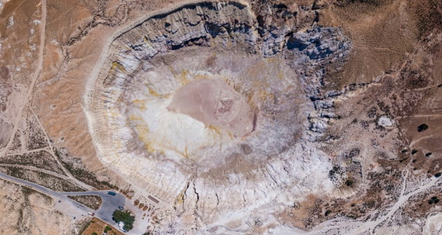 Aerial view of the large hydrothermal Stefanos crater in the volcanic landscape of Nisyros, Greece